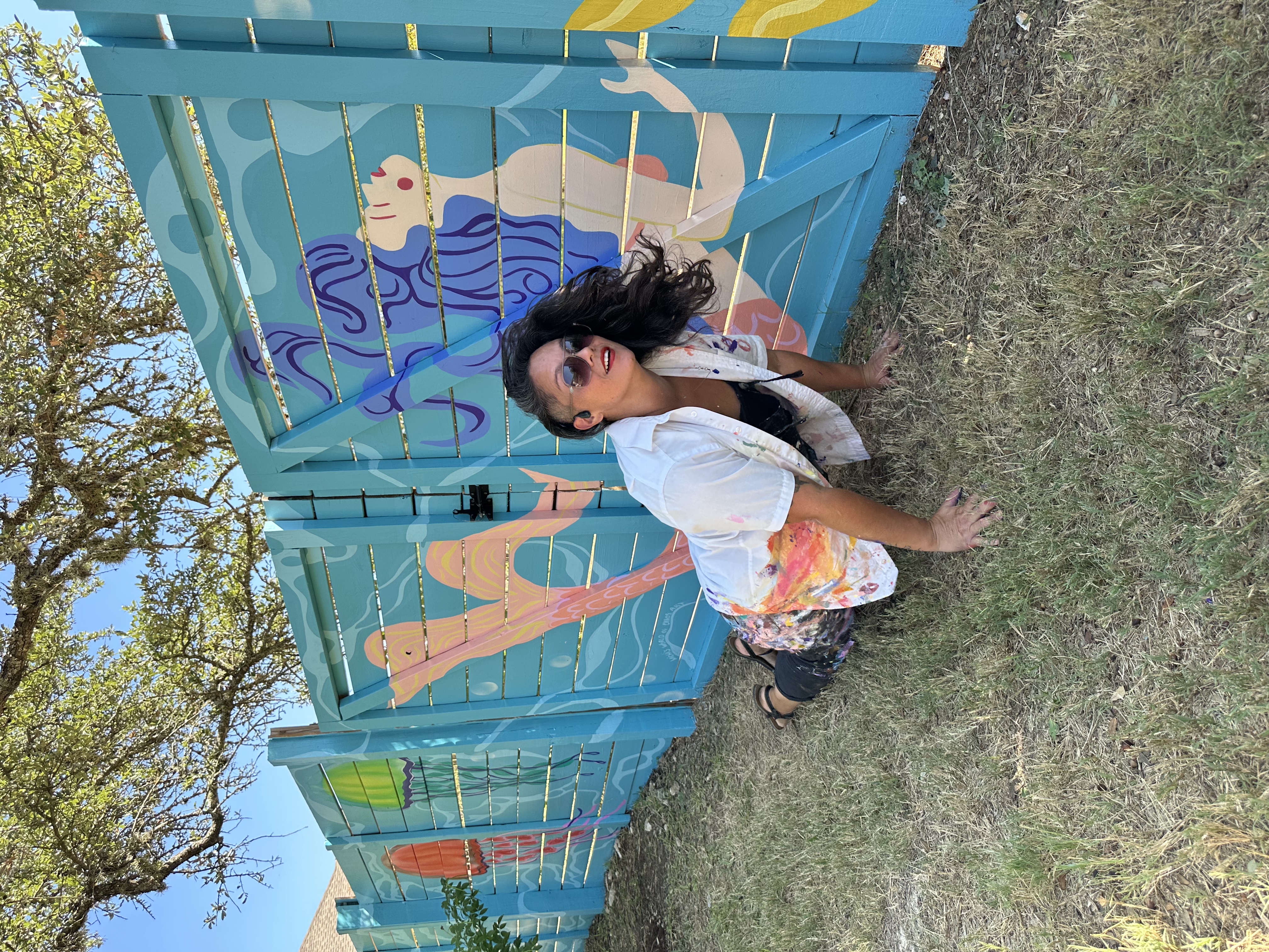 80-foot aquatic beach mural on a pool fence in Dripping Springs near Austin