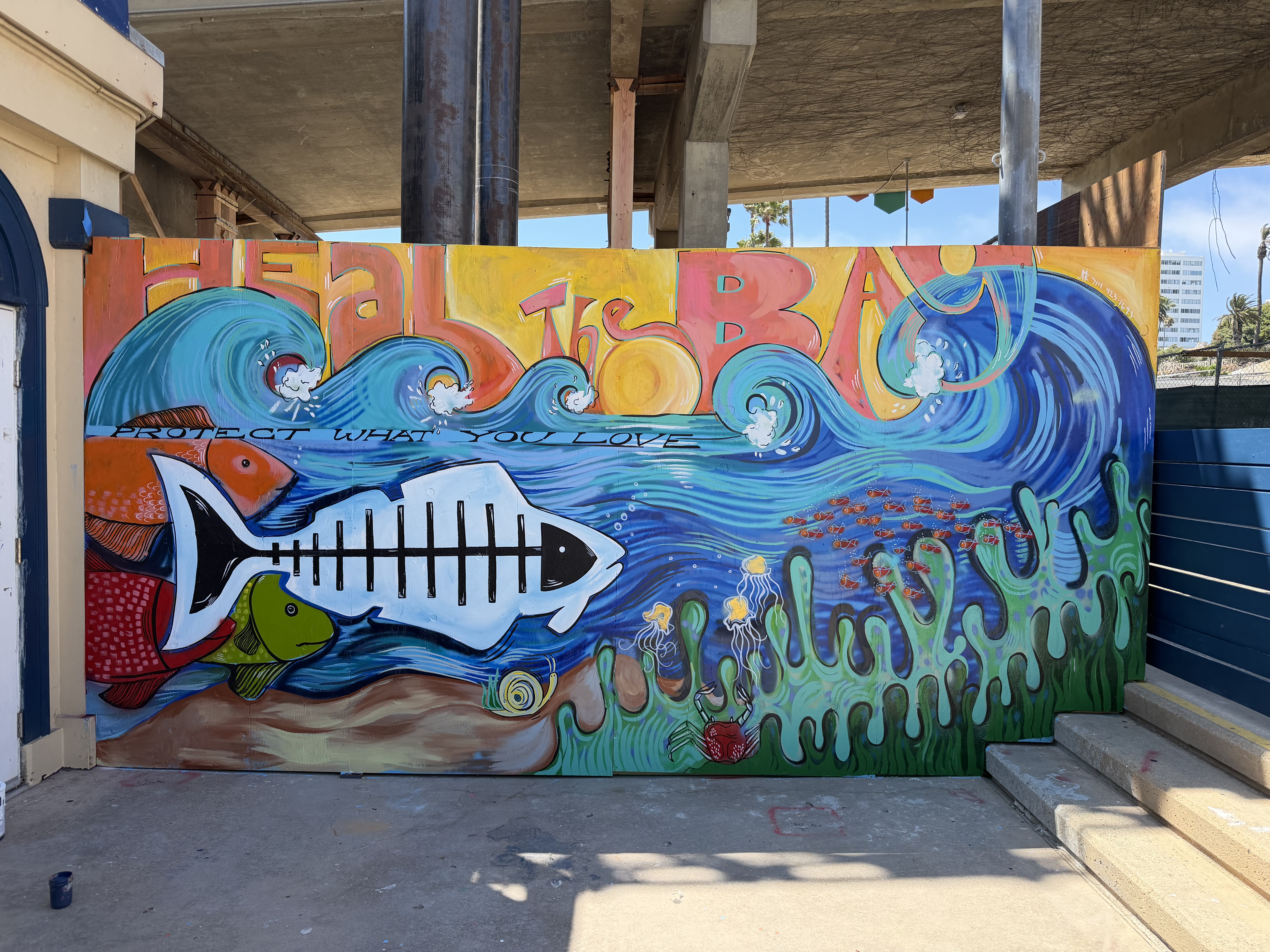 Heal the Bay ocean wave mural painted live on television by a Santa Monica mural artist